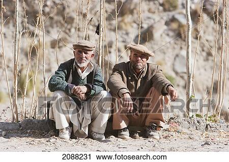 Stock Image - Men, Istak Nala, Northern Areas, Pakistan. Fotosearch