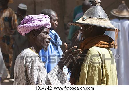 Men negotiating a deal at the Monday Market in Djenne, Mali View Large Photo Image Stock Image - Men negotiating a deal at the Monday Market in Djenne, Mali. Fotosearch