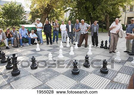 Stock Photo - Men Playing Chess On Trg Oslobodjenja (Liberation Square), Sarajevo, Bosnia And Herzegovina. Fotosearch
