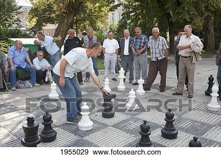 Men Playing Chess On Trg Oslobodjenja (Liberation Square), Sarajevo, Bosnia And Herzegovina View Large Photo Image Stock Photo - Men Playing Chess On Trg Oslobodjenja (Liberation Square), Sarajevo, Bosnia And Herzegovina. Fotosearch