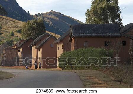 Merina Village Along The Road Between Ambositra & Ambavalao, Fianarantsoa Province, Madagascar View Large Photo Image Stock Photo - Merina Village Along The Road Between Ambositra & Ambavalao, Fianarantsoa Province, Madagascar. Fotosearch