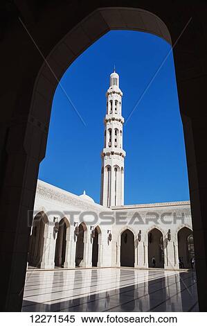 Stock Photography - Minaret and archway, Sultan Qaboos Grand mosque; Muscat, Oman. Fotosearch
