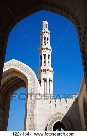 Stock Photo - Minaret and inscribed archway, Sultan Qaboos Grand mosque; Muscat, Oman. Fotosearch