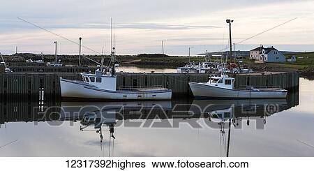 Mirror reflection of a dock and boats moored in a tranquil harbour, Cape Breton Island; Saint Joseph du Moine, Nova Scotia, Canada View Large Photo Image Stock Photograph - Mirror reflection of a dock and boats moored in a tranquil harbour, Cape Breton Island; Saint Joseph du Moine, Nova Scotia, Canada. Fotosearch