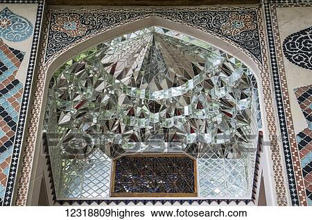 Stock Photograph - Mirrored murqanas in the facade of the Palace of Shaki Khans; Shaki, Azerbaijan. Fotosearch