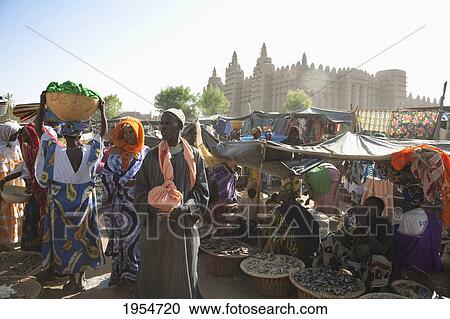 Stock Image - Monday Market with the Great Mosque in the background at Djenne, Mali. Fotosearch