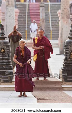 Stock Image - Monks Before The Entrance To The Mahabodi Temple, Bodhgaya, Bihar, India. Fotosearch