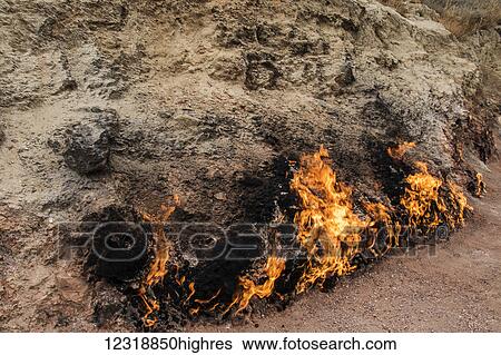 Stock Photograph - Natural gas fire which blazes continuously on a hillside, Yanar Dag, Absheron Peninsula; Baku, Azerbaijan. Fotosearch
