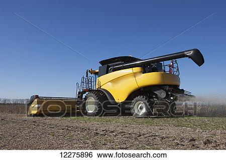 Stock Photograph - New Holland CR9060 Combine harvesting soybeans; Dyersville, Tennessee, United States of America. Fotosearch