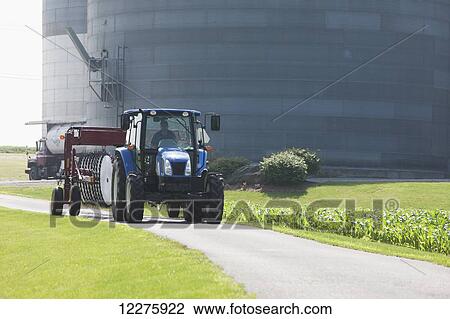 New Holland T5040 with H5980 wheel rake; New Holland, Pennsylvania, United States of America View Large Photo Image Stock Image - New Holland T5040 with H5980 wheel rake; New Holland, Pennsylvania, United States of America. Fotosearch