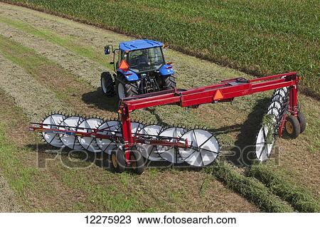 New Holland T5040 with H5980 wheel rake; New Holland, Pennsylvania, United States of America View Large Photo Image Stock Image - New Holland T5040 with H5980 wheel rake; New Holland, Pennsylvania, United States of America. Fotosearch