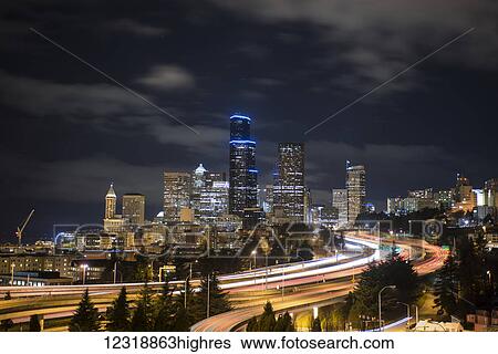Night image of Seattle cityscape and I-5 on a cloudy night; Seattle, Washington, United States of America View Large Photo Image Stock Photograph - Night image of Seattle cityscape and I-5 on a cloudy night; Seattle, Washington, United States of America. Fotosearch