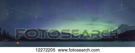 Nighttime panoramic view of a lit tent on a snow covered Trail Lake with the moon, stars, and Northern Lights overhead, Moose Pass, Kenai Peninsula, Southcentral Alaska View Large Photo Image Stock Photography - Nighttime panoramic view of a lit tent on a snow covered Trail Lake with the moon, stars, and Northern Lights overhead, Moose Pass, Kenai Peninsula, Southcentral Alaska. Fotosearch