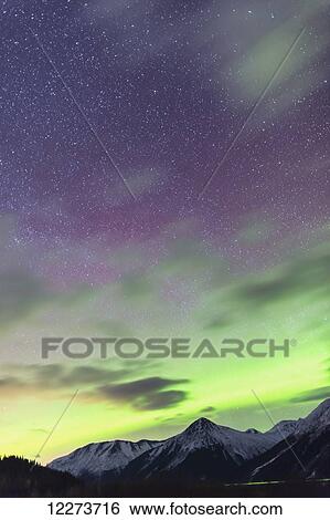 Stock Photograph - Northern Lights above the Chugach Mountains South of Girdwood, Southcentral Alaska, USA.. Fotosearch