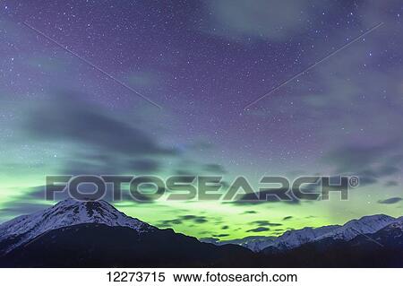 Stock Photography - Northern Lights above the Chugach Mountains South of Girdwood, Southcentral Alaska, USA.. Fotosearch