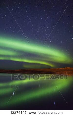 Stock Photography - Northern Lights reflected over the Noatak River on a clear night, Noatak, Arctic Alaska, USA, Fall. Fotosearch