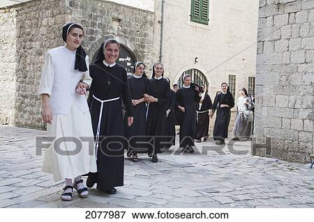 Stock Photo - Nuns Walking Through The Streets Of Kotor, Monte. Fotosearch