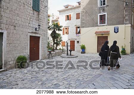 Stock Photo - Nuns Walking Through The Streets Of Kotor, Monte. Fotosearch