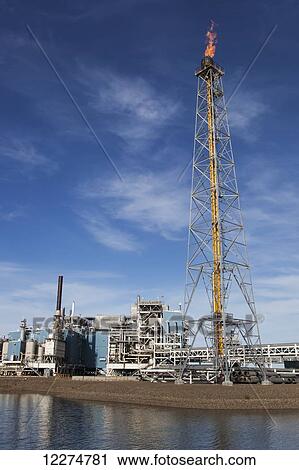 Oil production facilities and a flare tower on Endicott Island in the Prudhoe Bay Oil field, North Slope, Arctic Alaska, Summer View Large Photo Image Stock Image - Oil production facilities and a flare tower on Endicott Island in the Prudhoe Bay Oil field, North Slope, Arctic Alaska, Summer. Fotosearch
