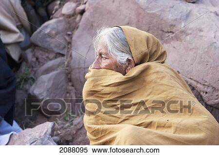 Stock Photography - Old Woman Waiting For Aid And Relief Goods Near The Line Of Control, Chakothi, Azad Kashmir, Pakistan. Fotosearch