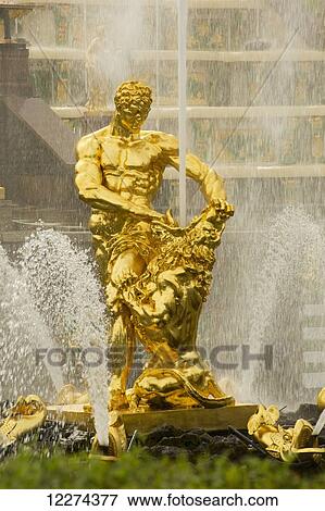 Stock Photo - Oranzhereiny Fountain depicting a triton grappling with the jaws of sea monster, Peterhof's Fountains at the Summer Palace, near St. Petersburg; Russia. Fotosearch