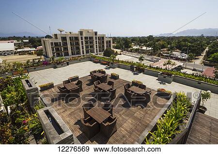 Stock Photo - Outdoor lounge of Plaza Hotel; Dili, East Timor. Fotosearch