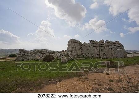 Stock Image - Outer Wall Made Of Rough Coralline Limestone Of The Ggantija Temples (3600 - 3200 B. C. ), Gozo Island, Malta. Fotosearch