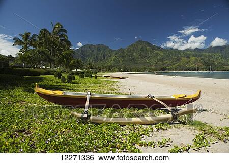 Outrigger canoe on Hanalei Beach; Hanalei, Kauai, Hawaii, United States of America View Large Photo Image Stock Photograph - Outrigger canoe on Hanalei Beach; Hanalei, Kauai, Hawaii, United States of America. Fotosearch