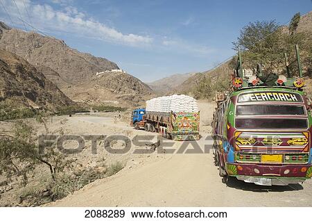 Stock Photo - Pakistani Truck And Bus Travelling On The Khyber Pass, Federally Administered Tribal Areas, Pakistan. Fotosearch