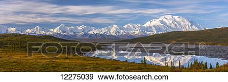 Panoramic autumn view of Mt. McKinley and Wonder Lake at sunrise, Denali National Park, Interior Alaska View Large Photo Image Stock Photo - Panoramic autumn view of Mt. McKinley and Wonder Lake at sunrise, Denali National Park, Interior Alaska. Fotosearch