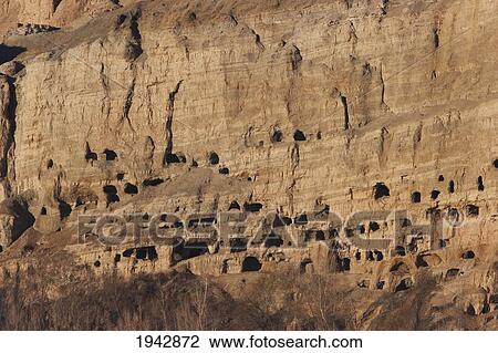 Stock Image - Panoramic View Of Bamiyan And The Escarpment With Hundreds Of Caves, Bamian Province, Afghanistan. Fotosearch