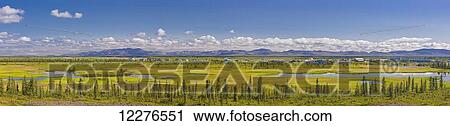 Panoramic view of the village of Noatak, surrounding wetlands and the Baird Mountains in the background, Arctic Alaska, summer View Large Photo Image Stock Image - Panoramic view of the village of Noatak, surrounding wetlands and the Baird Mountains in the background, Arctic Alaska, summer. Fotosearch