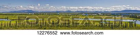 Panoramic view of the village of Noatak, surrounding wetlands and the Baird Mountains in the background, Arctic Alaska, summer View Large Photo Image Stock Image - Panoramic view of the village of Noatak, surrounding wetlands and the Baird Mountains in the background, Arctic Alaska, summer. Fotosearch