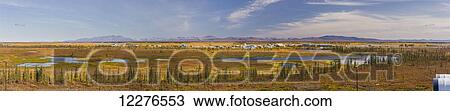 Panoramic view of the village of Noatak, surrounding wetlands and the Baird Mountains in the background, Arctic Alaska, autumn View Large Photo Image Stock Image - Panoramic view of the village of Noatak, surrounding wetlands and the Baird Mountains in the background, Arctic Alaska, autumn. Fotosearch