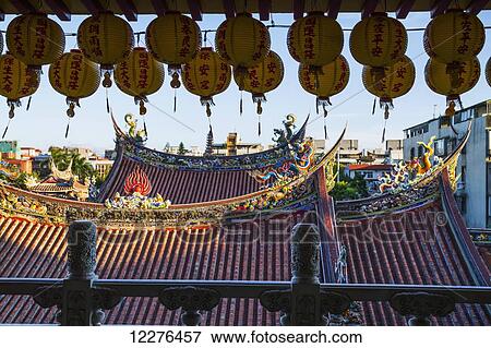 Stock Photo - Paper lanterns and roofs of the Dalongdong Baoan Temple; Taipei, Taiwan. Fotosearch