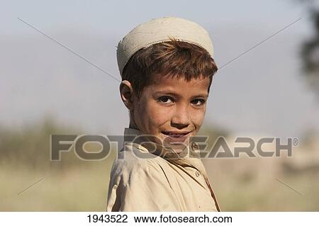 Stock Image - Pashtun Boy On The Torkham To Jalalabad Road, Nangarhar Province, Afghanistan. Fotosearch