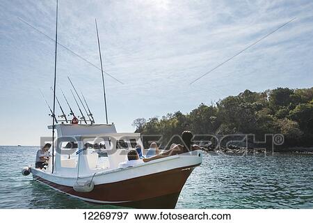 Passengers relaxing on a boat off the coast; Ixtapa-Zihuatanejo, Guerrero, Mexico View Large Photo Image Stock Photo - Passengers relaxing on a boat off the coast; Ixtapa-Zihuatanejo, Guerrero, Mexico. Fotosearch