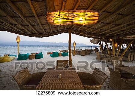 Pearl Beach Lounge at dusk, Gili Trawangan, West Nusa Tenggara, Indonesia View Large Photo Image Stock Photo - Pearl Beach Lounge at dusk, Gili Trawangan, West Nusa Tenggara, Indonesia. Fotosearch
