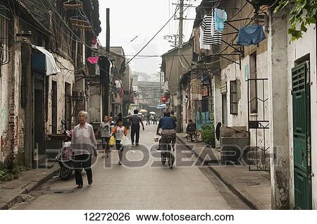 Pedestrians and cyclists on an old street with a pagoda in the distance through the haze; Wuhan, Hubei province, China View Large Photo Image Stock Photograph - Pedestrians and cyclists on an old street with a pagoda in the distance through the haze; Wuhan, Hubei province, China. Fotosearch