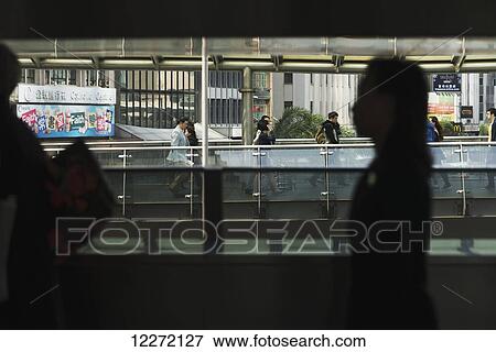 Pedestrians on a gateway in Central; Hong Kong, China View Large Photo Image Stock Photo - Pedestrians on a gateway in Central; Hong Kong, China. Fotosearch
