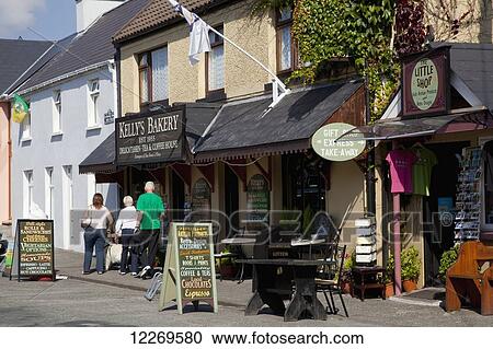 Pedestrians walking outside shops; Sneem, County Kerry, Ireland View Large Photo Image Stock Image - Pedestrians walking outside shops; Sneem, County Kerry, Ireland. Fotosearch