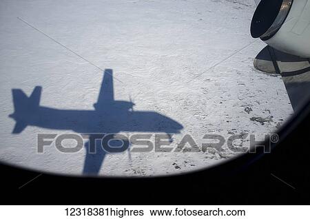 Stock Photograph - Pen Air plane approaching Anchorage airport; Alaska, United States of America. Fotosearch