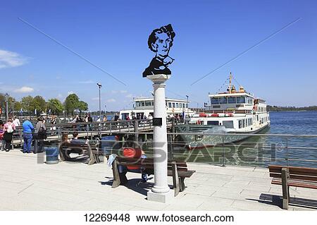 People boarding a boat in the waterfront; Am Chiemsee, Bayern, Germany View Large Photo Image Stock Photo - People boarding a boat in the waterfront; Am Chiemsee, Bayern, Germany. Fotosearch