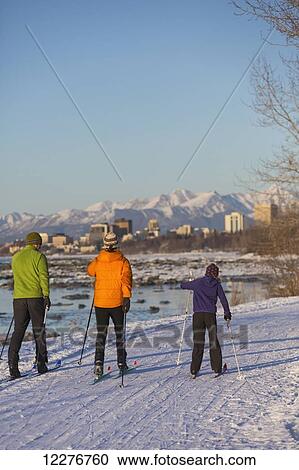 People cross country skiing on the Tony Knowles Coastal Trail near Earthquake Park with Anchorage skyline in the background, Cook Inlet, Southcentral Alaska View Large Photo Image Stock Image - People cross country skiing on the Tony Knowles Coastal Trail near Earthquake Park with Anchorage skyline in the background, Cook Inlet, Southcentral Alaska. Fotosearch