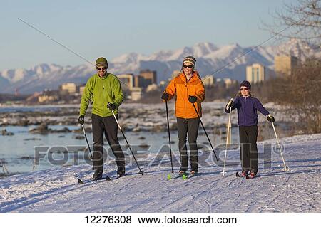 People cross country skiing on the Tony Knowles Coastal Trail near Earthquake Park with Anchorage skyline in the background, Cook Inlet, Southcentral Alaska View Large Photo Image Stock Photo - People cross country skiing on the Tony Knowles Coastal Trail near Earthquake Park with Anchorage skyline in the background, Cook Inlet, Southcentral Alaska. Fotosearch