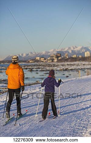 People cross country skiing on the Tony Knowles Coastal Trail near Earthquake Park with Anchorage skyline in the background, Cook Inlet, Southcentral Alaska View Large Photo Image Stock Photo - People cross country skiing on the Tony Knowles Coastal Trail near Earthquake Park with Anchorage skyline in the background, Cook Inlet, Southcentral Alaska. Fotosearch