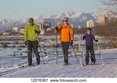 People cross country skiing on the Tony Knowles Coastal Trail near Earthquake Park with Anchorage skyline in the background, Cook Inlet, Southcentral Alaska View Large Photo Image Stock Photo - People cross country skiing on the Tony Knowles Coastal Trail near Earthquake Park with Anchorage skyline in the background, Cook Inlet, Southcentral Alaska. Fotosearch
