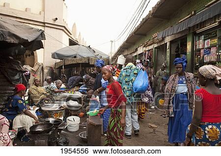 Stock Photograph - People in the market at Bamako, Mali. Fotosearch