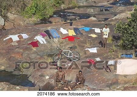 People Laundering Clothes On A River Along The Road Between Ambositra & Ambavalao, Fianarantsoa Province, Madagascar View Large Photo Image Stock Photograph - People Laundering Clothes On A River Along The Road Between Ambositra & Ambavalao, Fianarantsoa Province, Madagascar. Fotosearch