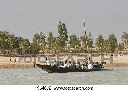 People on a sail boat on the Niger River between Niafunke and Kabara, Mali View Large Photo Image Stock Image - People on a sail boat on the Niger River between Niafunke and Kabara, Mali. Fotosearch